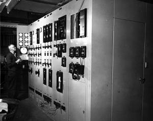 A Worker Reading the  Control Panel  of  the Boiler Room