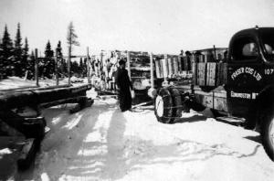 A Fraser Truck Pulling a Sled Loaded with Logs