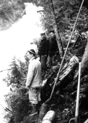Log Drivers Near a Waterfall