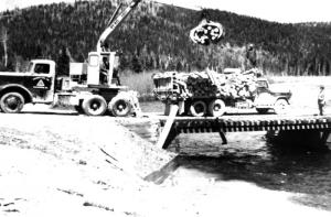 A Crane Unloading  Logs