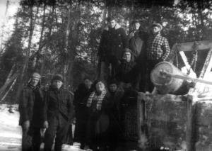 A Group of Men in Front of a Rig to Ice Roads