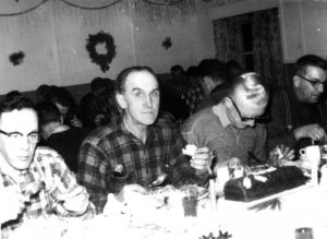 Four Forest Workers Taking a Christmas Meal