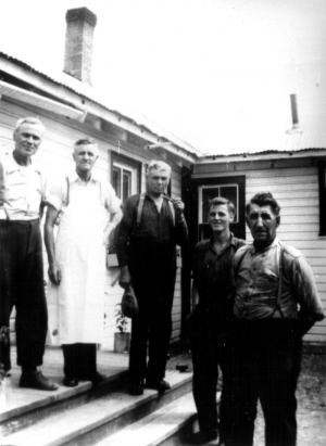 Men in Front of a Building at the Summit Depot