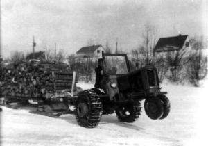 Tractor Hauling a Loaded Sled