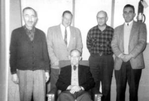 Mr, Alcide Blanger Sitting on a Chair at the Summit Depot