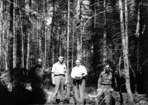 Mr. Lo Dionne and Three Loggers at Camp 58