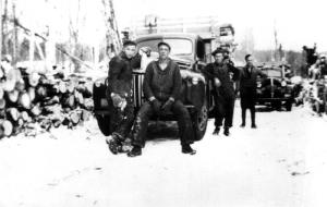 A Group of Workers in Front of a Truck