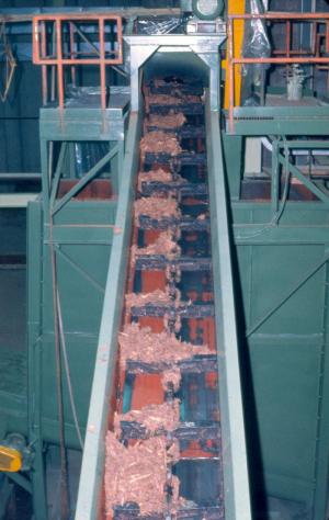 Conveyor Bringing Bark in the no. 4  Waste-heat Oven in the Wood Room of the Edmundston Fraser Mill
