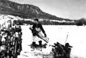 Man Piling Salvaged Wood  from the Madawaska River