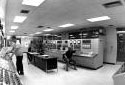 Four Persons Monitor the Control Panels Inside the Recuperation Oven Building at the Fraser Mill in Edmundston