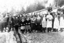 Group of Persons in Front of a Camp