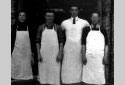 Four Cooks Wearing Their Aprons