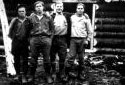 Four Loggers in Front of a Camp