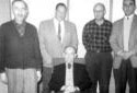 Mr, Alcide Blanger Sitting on a Chair at the Summit Depot