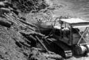 Bulldozer Pushing Logs into the Kedgwick River