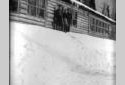 Workers in Front of a Log Cabin